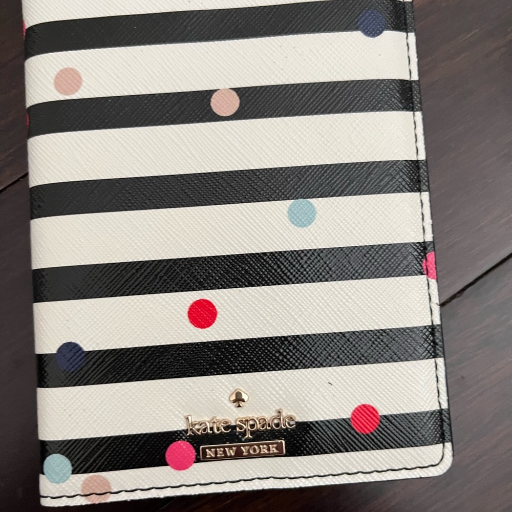 Kate Spade Black striped with coloured polkadot passport Holder with Gold Logo.
